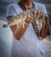 Young woman holding a baby alligator in her hands