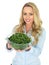 Young Woman Holding a Bowl of Cooked Green French Beans