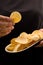 Young woman holding chickpea chips