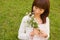 Young woman holding flower