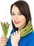 Young Woman Holding Fresh Asparagus