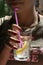 Young woman holding a glass of lemonade