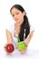 Young woman holding GMO apple with three syringe