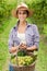 Young woman holding grapes