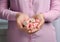 Young woman holding handful of tasty jelly candies