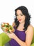 Young Woman Holding a Large Bowl Of Colourful Fresh Crisp Mixed Garden Salad