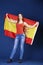 Young woman holding a large Spanish flag