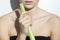 Young woman holding a leek