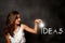 Young woman holding a lightbulb