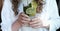 Young woman holding mojito glass