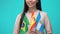 Young woman holding national flags of Brazil Spain Argentina, language school