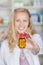 Young Woman Holding Pill Bottle