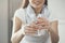 Young woman holding pure glass of water