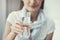 Young woman holding pure glass of water