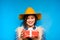 Young woman holding red gift in hands