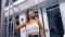 Young woman holding with right hand inside Barcelona tube