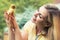 A young woman,holding a small duckling.