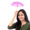 Young woman holding small umbrella - Money saving