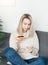 Young woman holding smartphone and banking credit card