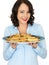 Young Woman Holding a Tray of Roast Parsnips