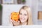 Young Woman Holding Yellow Piggybank