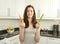 Young woman holds carrot and celery