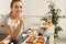 Young woman with homemade oven baked pastry