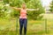 Young woman with hoola hoop outdoors