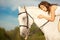 Young woman on a horse. Horseback rider, woman riding horse on b