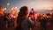 The young woman, immersed in the vibrant atmosphere of the music festival, captures the magic of the moment with her smartphone.