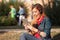 Young woman impressed and excited listening to music on the tablet