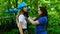 A young woman instructor puts on the helmet pendants on a woman