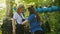 A young woman instructor puts on the insurance pendants with hook on the waist of a woman