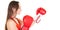 Young woman isolated on white background wearing red boxing gloves working out with box aerobics cardio