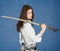 Young woman with the Japanese sword in a hand