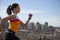 Young woman jogging in city.