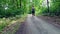 Young woman jogging through forest