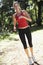 Young Woman Jogging Through Woods