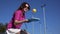 Young woman juggling with a pickleball ball outdoors in slow motion