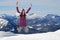 Young woman jumping for joy and happiness in mountains