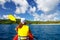 Young woman kayaking near Drawaqa Island in Yasawas, Fiji