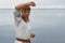 Young Woman in Kimono practicing karate on river coast