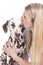 Young woman kisses dalmatian dog