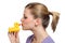 Young woman kissing the yellow rubber duck