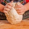 Young woman kneading dough. Food, Ñooking process, sweets concept