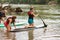 Young Woman Kneels On Paddleboard In Chattahoochee River