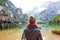 Young woman on lake braies in south tyrol, italy