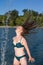 Young Woman in Lake Flipping Wet Hair Dramatically