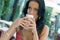 Young woman with latte macchiato