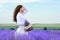 Young woman is in the lavender flower field, beautiful summer landscape